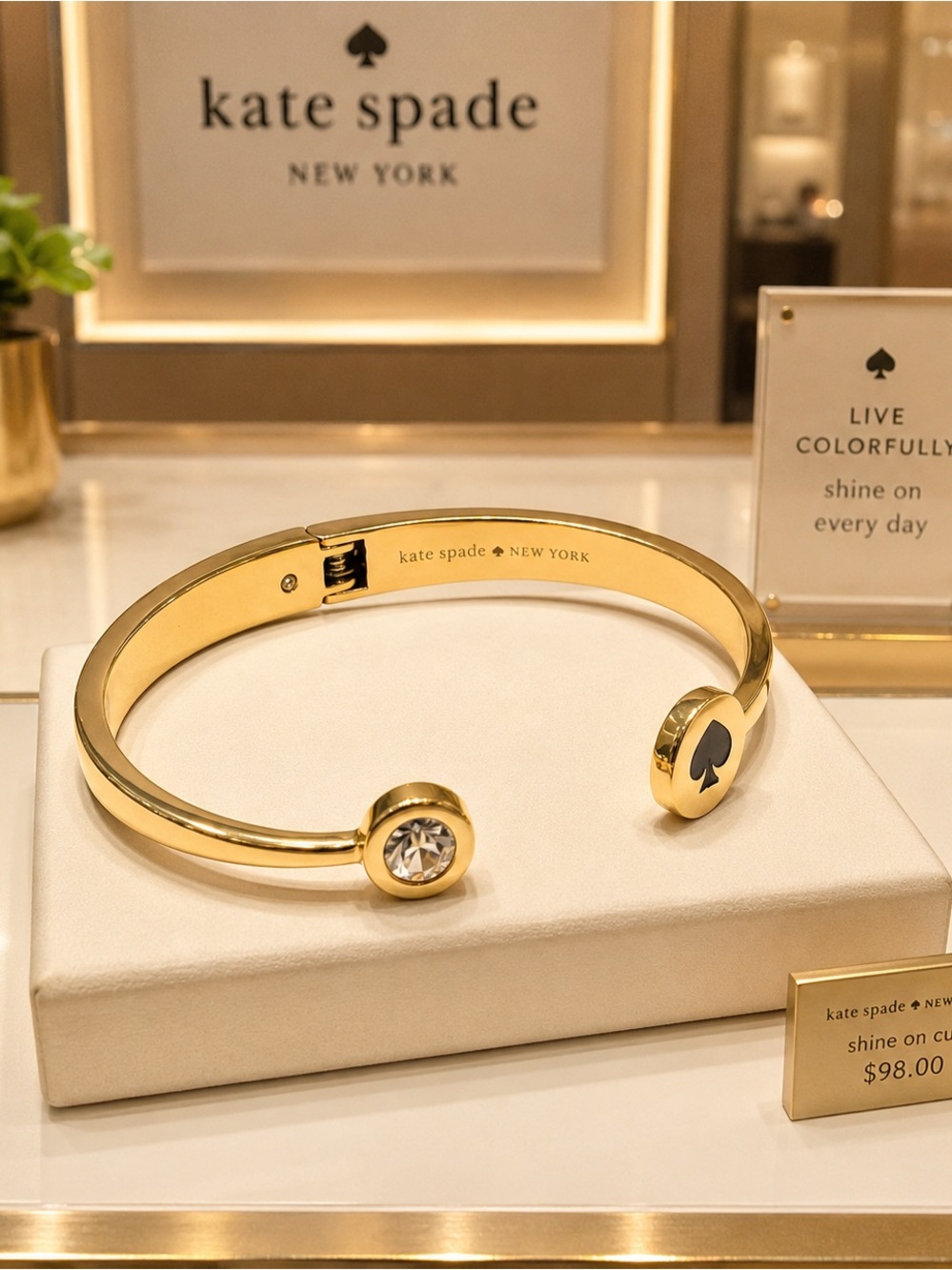 Kate Spade New York Gold Tone Bangle Bracelet with Spade Spot Design